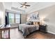 Spacious main bedroom features a tray ceiling, plush bedding, and abundant natural light at 3386 Vintage Se Cir # 8, Smyrna, GA 30080