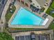 An aerial view of a community pool surrounded by lounge chairs and well maintained landscaping at 3386 Vintage Se Cir # 8, Smyrna, GA 30080