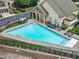 Aerial view of a sparkling blue swimming pool surrounded by lounge chairs at 3386 Vintage Se Cir # 8, Smyrna, GA 30080