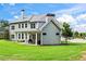 Spacious backyard featuring a covered patio and lush green lawn at 4115 Williams Point Dr, Cumming, GA 30028