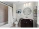 Well-lit bathroom with a shower-tub combo, modern fixtures, and stylish décor for everyday comfort at 4115 Williams Point Dr, Cumming, GA 30028