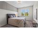 Cozy bedroom featuring natural light, a decorative headboard, and carpeted floors at 4115 Williams Point Dr, Cumming, GA 30028