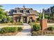 Charming brick clubhouse with a sign that reads, 'The Retreat', surrounded by manicured landscaping at 4115 Williams Point Dr, Cumming, GA 30028