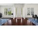 Bright foyer featuring hardwood floors, large windows, and a view to the outside at 4115 Williams Point Dr, Cumming, GA 30028