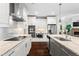 Modern kitchen featuring white cabinets, stainless steel appliances, and granite countertops at 4115 Williams Point Dr, Cumming, GA 30028