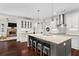 Bright, open kitchen with a large island, modern appliances, and hardwood floors at 4115 Williams Point Dr, Cumming, GA 30028