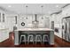 Open concept kitchen with an island, stainless steel appliances, and plenty of storage at 4115 Williams Point Dr, Cumming, GA 30028