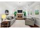 Spacious living room boasts a stone fireplace, vaulted ceilings, and lots of natural light at 4115 Williams Point Dr, Cumming, GA 30028