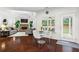 Bright open-concept featuring hardwood floors, fireplace, and a breakfast nook with backyard access at 4115 Williams Point Dr, Cumming, GA 30028
