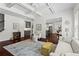 Inviting living room featuring hardwood floors, neutral decor, and ample natural light at 4115 Williams Point Dr, Cumming, GA 30028
