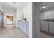 This main bathroom provides a double vanity with access to a laundry room and the main bedroom at 4115 Williams Point Dr, Cumming, GA 30028