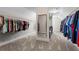 Expansive walk-in closet with ample storage space and custom shelving for organized living at 4115 Williams Point Dr, Cumming, GA 30028