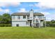 Spacious backyard featuring a deck and patio, perfect for outdoor enjoyment at 4914 Watson Mill Ct, Loganville, GA 30052