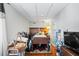 Basement with bed, TV, and other personal items at 4914 Watson Mill Ct, Loganville, GA 30052