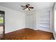 The bedroom offers wood-look flooring and a built-in shelving unit for storage or display at 4914 Watson Mill Ct, Loganville, GA 30052