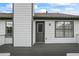 Grey wooden deck with back door and two windows and white vinyl siding at 4914 Watson Mill Ct, Loganville, GA 30052