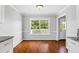 Bright dining area with hardwood floors and lots of natural light from the window at 4914 Watson Mill Ct, Loganville, GA 30052