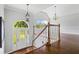 Welcoming foyer boasts hardwood floors, a vaulted ceiling and grand staircase at 4914 Watson Mill Ct, Loganville, GA 30052