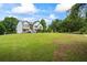 Charming two-story home with a well-manicured lawn and a welcoming entrance at 4914 Watson Mill Ct, Loganville, GA 30052