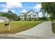 Inviting home with a manicured lawn and a lengthy driveway at 4914 Watson Mill Ct, Loganville, GA 30052