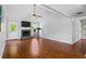 Spacious living room with a fireplace, hardwood floors, and a vaulted ceiling at 4914 Watson Mill Ct, Loganville, GA 30052