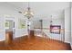 Beautiful living space featuring hardwood floors, a chandelier, and natural light at 4914 Watson Mill Ct, Loganville, GA 30052