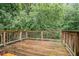 View of back deck overlooking wooded lot at 1034 Sandy Ridge Rd, Mcdonough, GA 30252