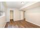 Basement featuring wood-look floors and a closet with white doors at 1034 Sandy Ridge Rd, Mcdonough, GA 30252