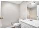 Bathroom featuring a single vanity, toilet, and framed mirror at 1034 Sandy Ridge Rd, Mcdonough, GA 30252