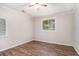 Comfortable bedroom with wood-look flooring, neutral walls, and a ceiling fan providing a cozy retreat at 1034 Sandy Ridge Rd, Mcdonough, GA 30252