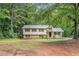 Traditional home with lush, wooded surroundings at 1034 Sandy Ridge Rd, Mcdonough, GA 30252