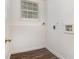 Simple laundry area with a window and utility hookups, providing a practical space for laundry needs at 1034 Sandy Ridge Rd, Mcdonough, GA 30252