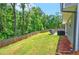 Fenced backyard with grill, lawn furniture and green space at 6375 Eidson Dr, Cumming, GA 30041