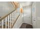 Hallway featuring wood stairs, a white interior door, and views of the upper level at 6375 Eidson Dr, Cumming, GA 30041
