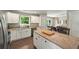 Granite countertops, white cabinets and stainless appliances make this kitchen shine! at 6375 Eidson Dr, Cumming, GA 30041