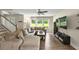 Inviting living room featuring a large sofa, neutral tones, and plenty of natural light at 6375 Eidson Dr, Cumming, GA 30041