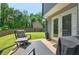 Backyard patio featuring outdoor furniture, and well-maintained lawn at 6375 Eidson Dr, Cumming, GA 30041