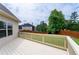 Back deck overlooking the backyard featuring a lawn and wood privacy fence at 6585 Canyon Cv, Cumming, GA 30028