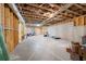 Unfinished basement with exposed wood beams, ductwork, and concrete flooring at 6585 Canyon Cv, Cumming, GA 30028