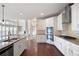 Bright kitchen boasts stainless appliances, granite countertops, and an open layout at 6585 Canyon Cv, Cumming, GA 30028