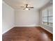Cozy living room showcasing hardwood floors and large windows to view the outdoors at 6585 Canyon Cv, Cumming, GA 30028