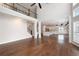 Spacious living room with hardwood floors, tall ceilings, and an open floor plan layout at 6585 Canyon Cv, Cumming, GA 30028