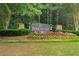 The Parkstone community entrance features a beautifully landscaped sign, welcoming residents and guests at 6585 Canyon Cv, Cumming, GA 30028