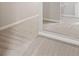 Spacious walk-in closet featuring carpet and mirrored doors at 6585 Canyon Cv, Cumming, GA 30028