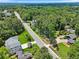 An aerial view of a home near a paved road and lush trees at 905 John Ward Rd, Marietta, GA 30064