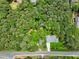 An aerial perspective shows a home and its surroundings, with lush trees offering plenty of shade at 905 John Ward Rd, Marietta, GA 30064