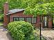Charming exterior of a quaint house with beautiful foliage and a welcoming entrance at 905 John Ward Rd, Marietta, GA 30064