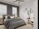Cozy bedroom with plush bedding, stylish decor, ceiling fan, and natural light from two windows at 1161 Dahlonega Hwy # 12, Cumming, GA 30040