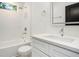 Bright bathroom featuring subway tiles, tub, vanity and modern finishes at 1473 Lansing Se St, Atlanta, GA 30315