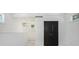 Bedroom with bright white walls and contrasting black doors at 1473 Lansing Se St, Atlanta, GA 30315